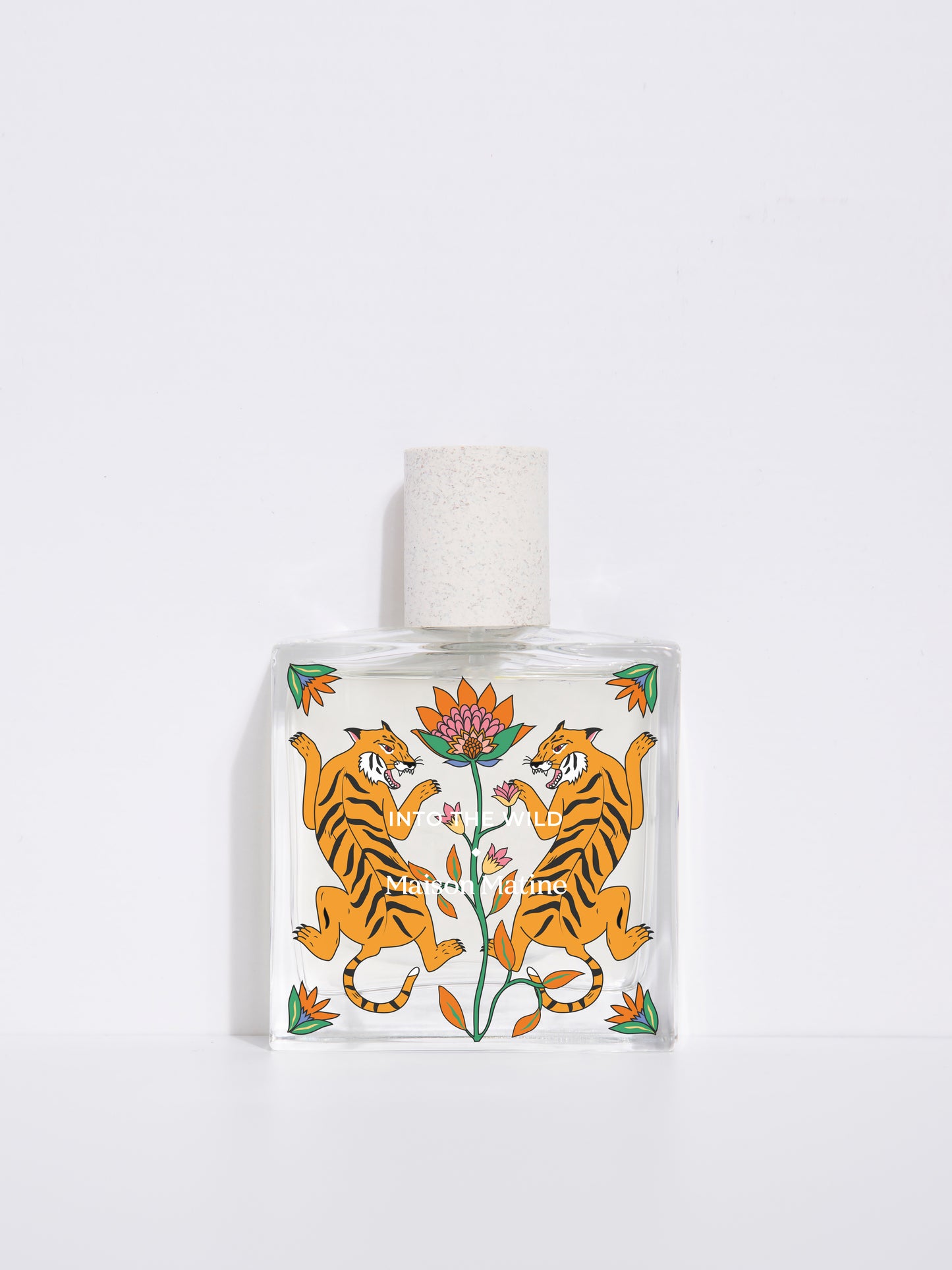 into the wild de Maison Matine, perfume nicho con ilustracion de tigres y flores en el bote cuadrado