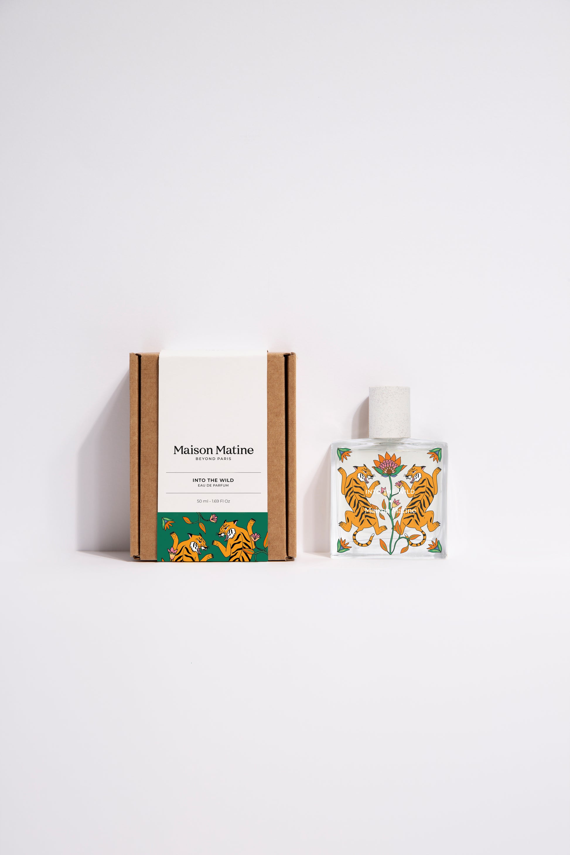 into the wild de Maison Matine, perfume nicho con ilustracion de tigres y flores en el bote cuadrado