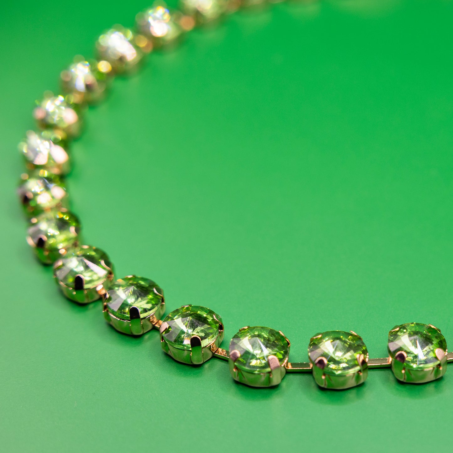 green crystal necklace with golden metal swarowski style