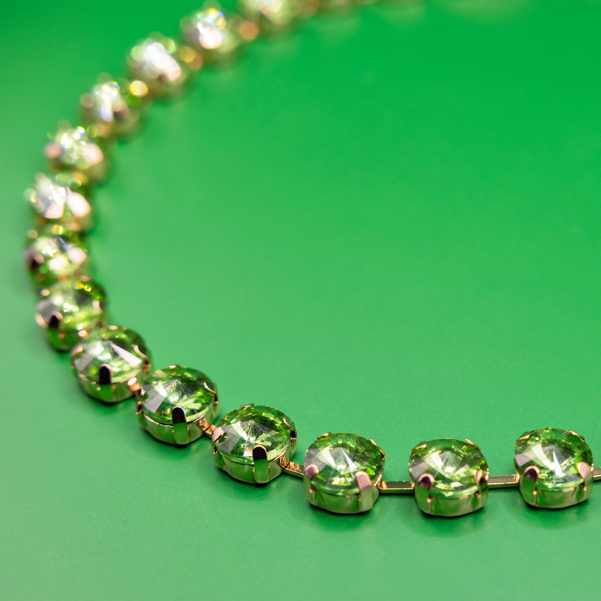 green crystal necklace with golden metal swarowski style