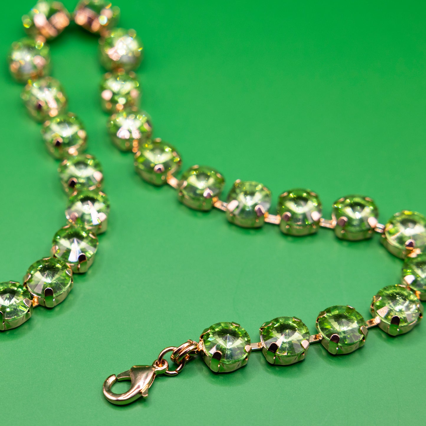 green crystal necklace with golden metal swarowski style