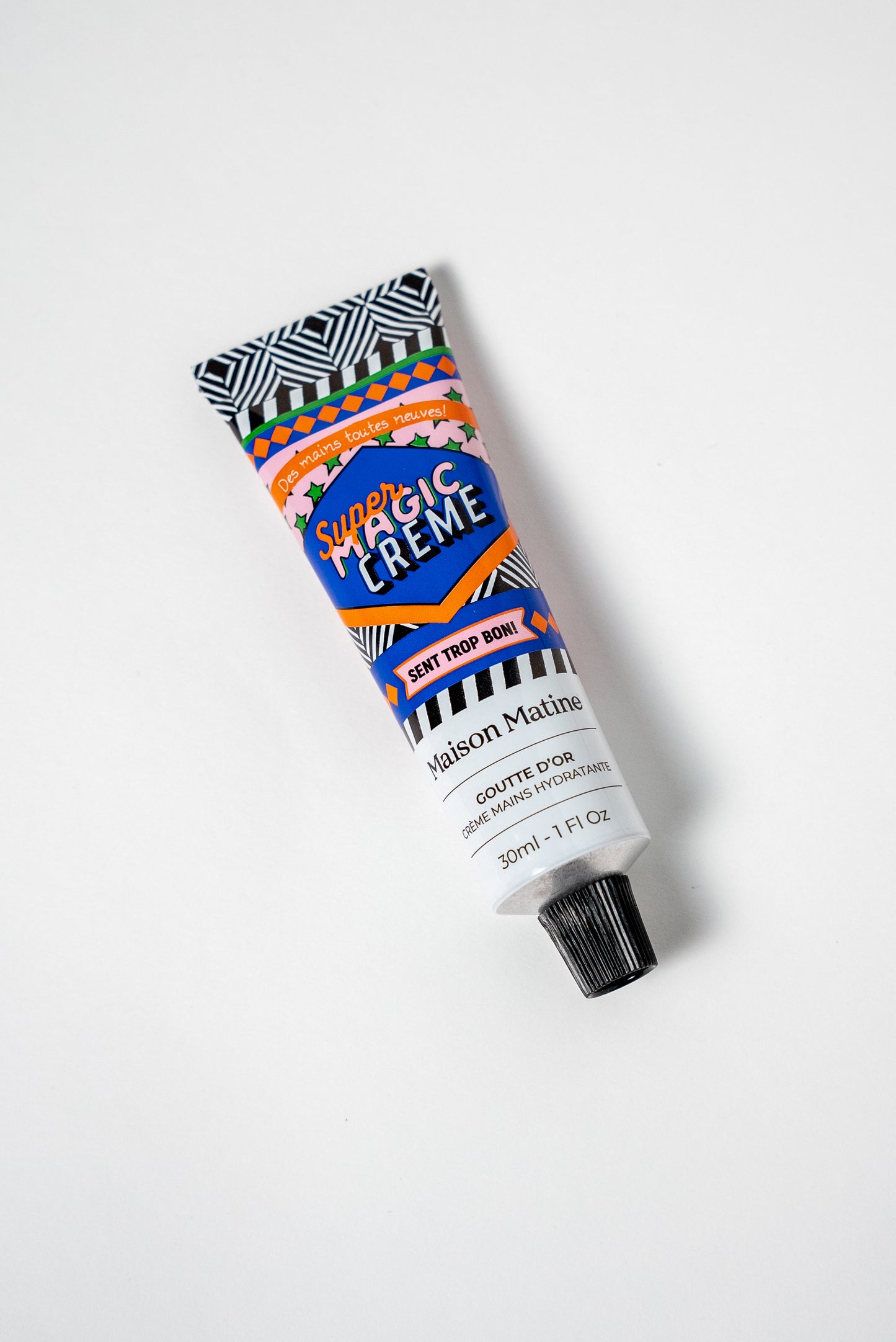 GOUTTE D'OR hand cream de Maison Matine con bote de colores azul, rosa, blanco y negro