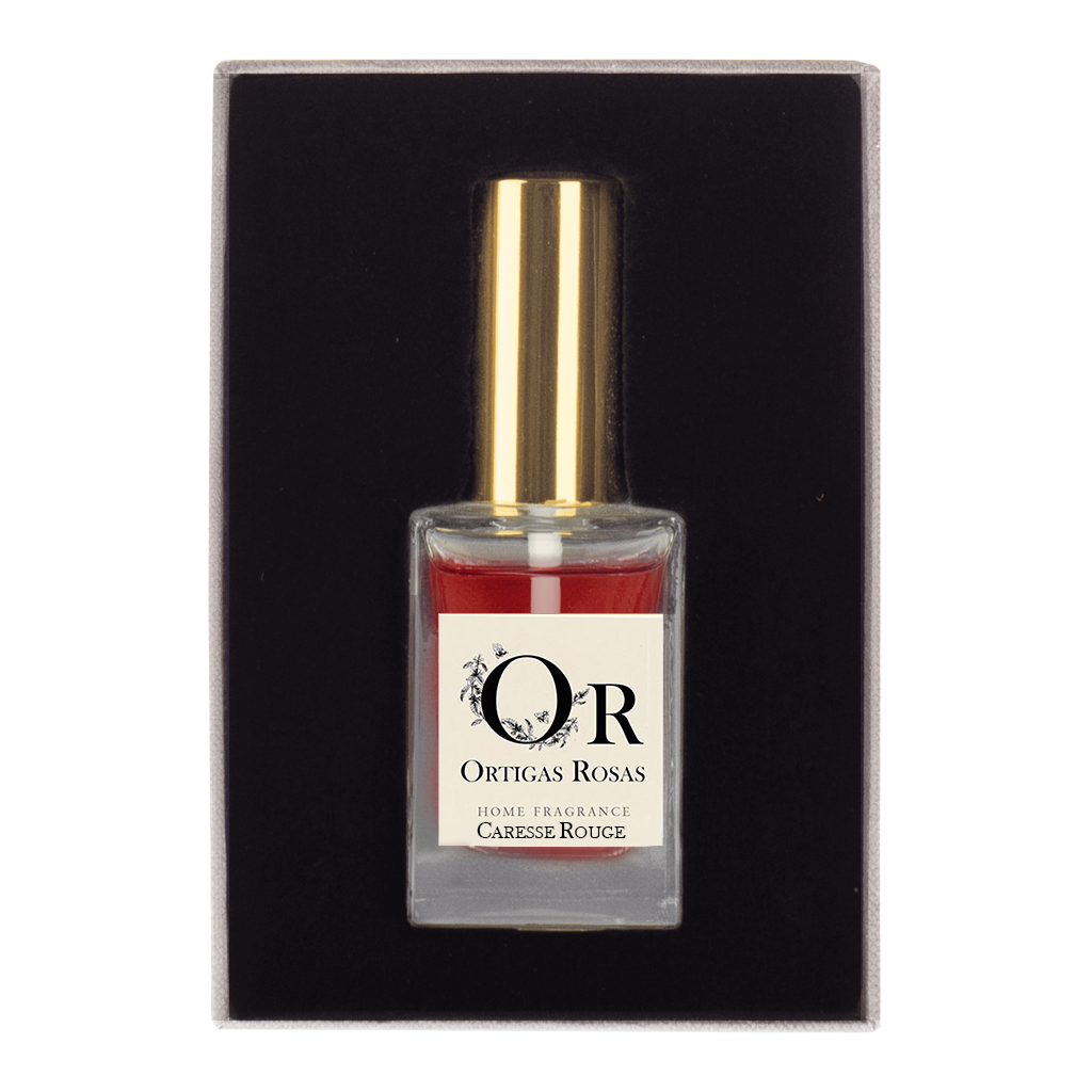 Caresse rouge perfume en tamaño de viaje en envase de cristal transparente con tapon dorado