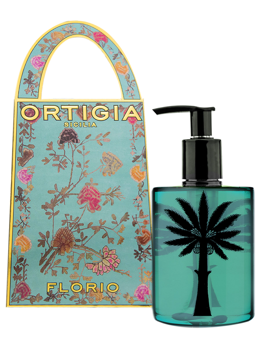 Frasco y estuche del perfume Ortigia Sicilia Florio con diseño de palmera sobre y flores con fondo color turquesa y caja con elementos dorados
