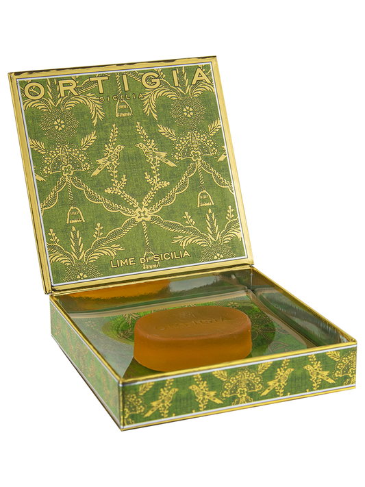 Bar of soap in a decorative green box with 'Ortigia' branding on a white background