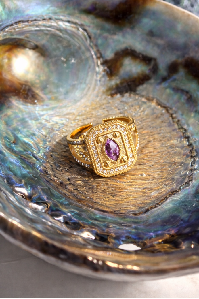 Gold rectangular ring with a lilac gemstone  by ortigas rosas