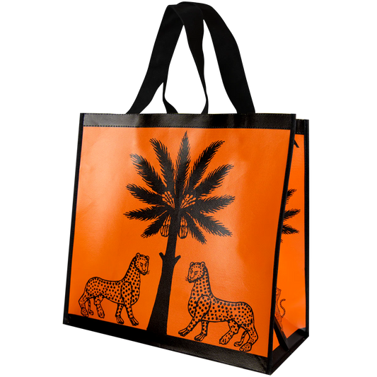 Tote bag with leopards and palm tree design on an orange background