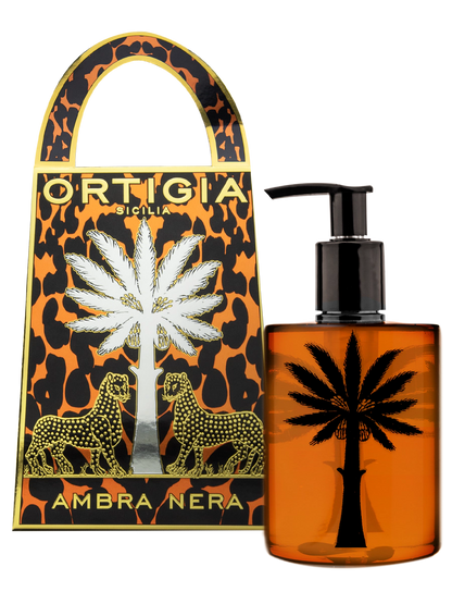 Frasco y estuche del perfume Ortigia Sicilia Ambra Nera con diseño de palmera y leopardo color dorado