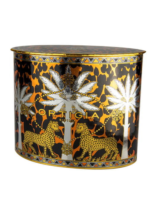 caja color dorado y negro con estampado animalier con palmera color plata y leopardos y jabon liquido color marron y palmera y leopardos y vela y jabon y crema manos