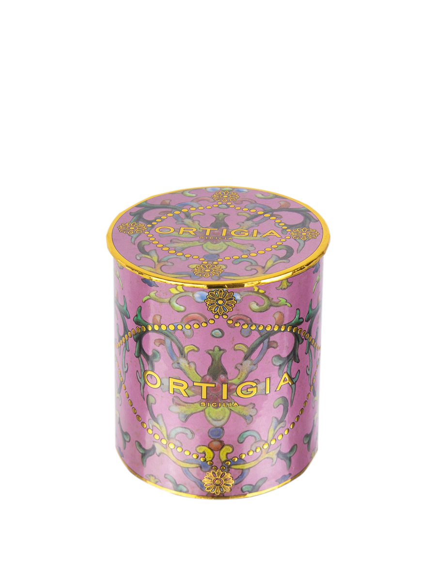 Decorative pink candle Aragona with gold accents and 'Ortigia' branding on a white background