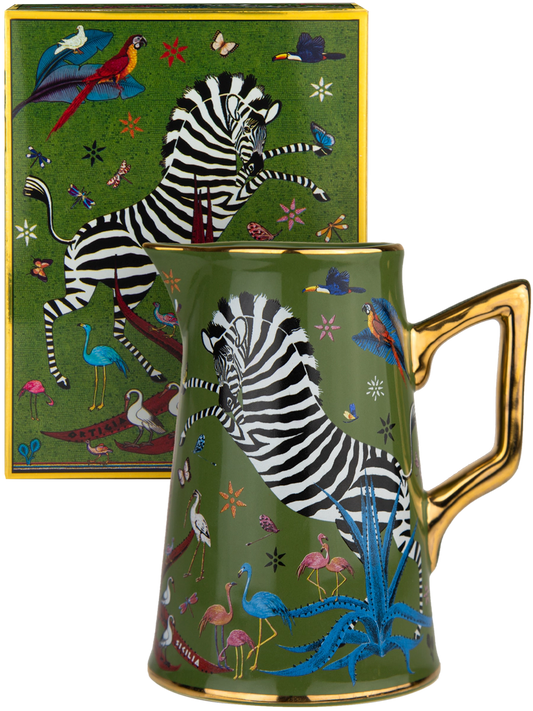 Taza con diseño de cebra y animales coloridos sobre fondo verde, acompañada de una caja a juego de la marca Ortigia Sicilia