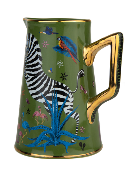 Taza con diseño de cebra y animales coloridos sobre fondo verde, acompañada de una caja a juego de la marca Ortigia Sicilia