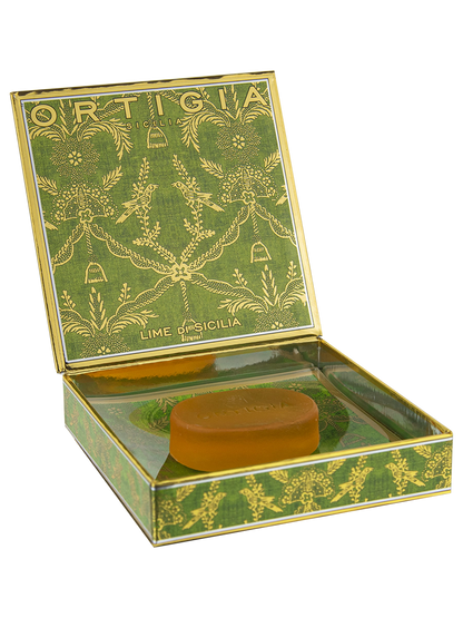 Bar of soap in a decorative green box with 'Ortigia' branding on a white background