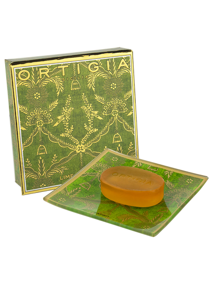 Bar of soap on a green soap dish with 'Ortigia' branding