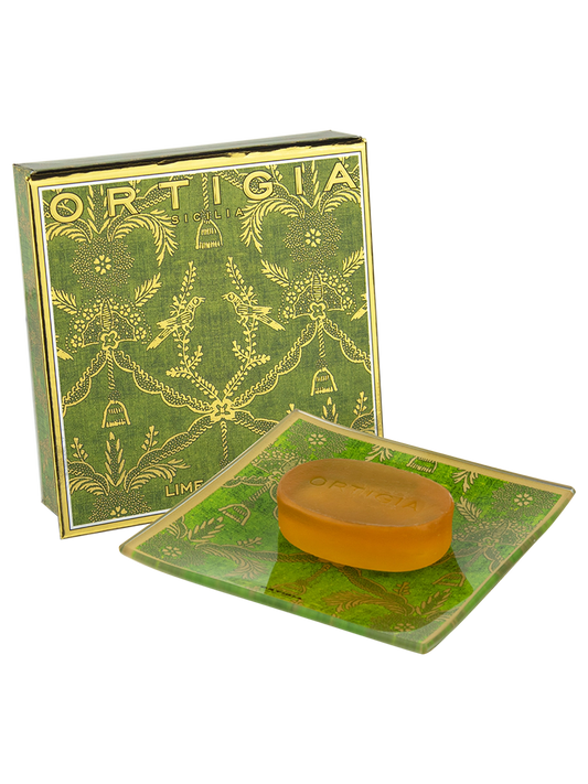 Bar of soap on a green soap dish with 'Ortigia' branding